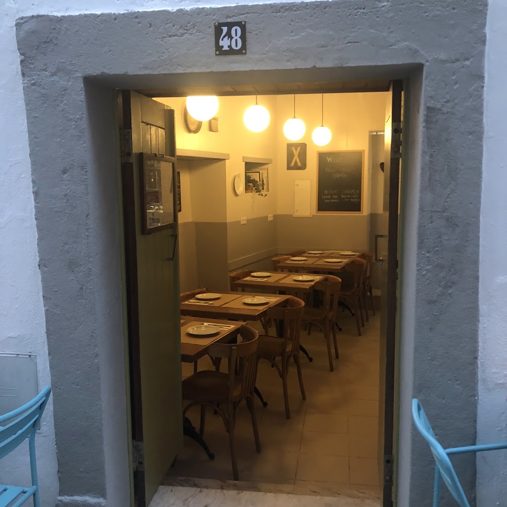 Warm and intimate dining room at Calma Tavern with candlelit tables